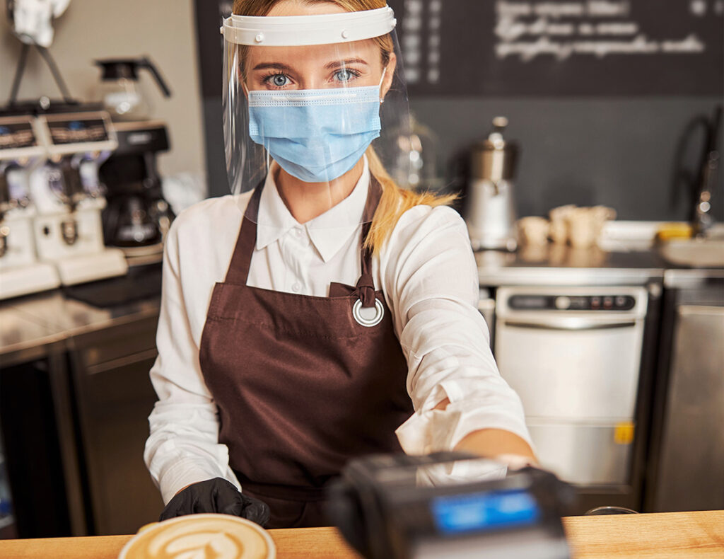 charming barista stylish uniform taking pos terminal payment